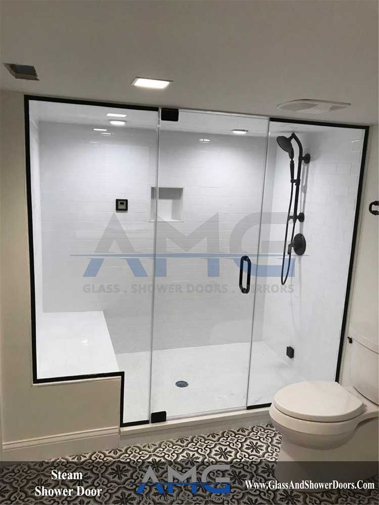 Sliding glass shower doors in a modern grey bathroom